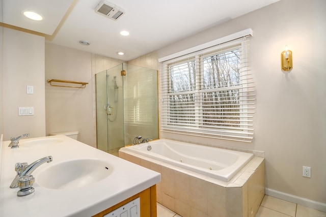 bathroom featuring visible vents, a sink, a shower stall, and a tub with jets