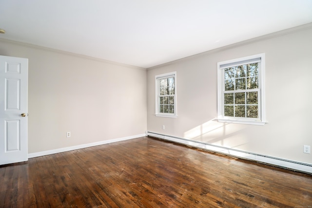 empty room with a baseboard heating unit, baseboards, wood-type flooring, and crown molding