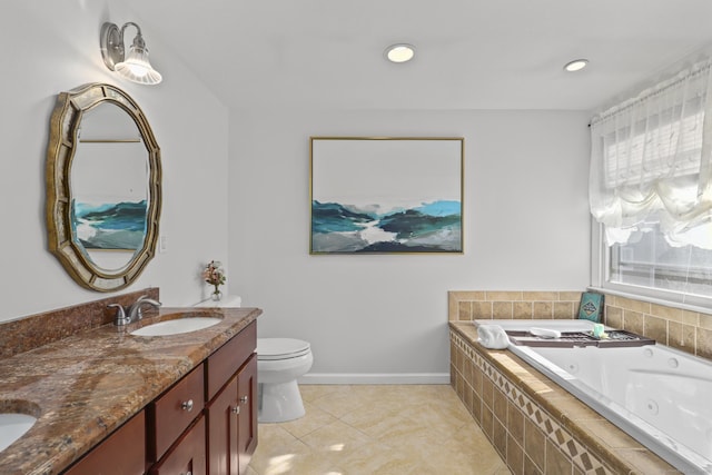 bathroom with double vanity, toilet, a tub with jets, tile patterned flooring, and a sink