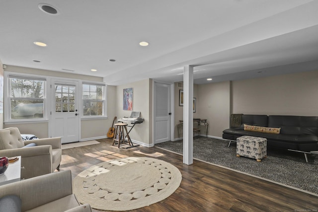 living area featuring recessed lighting, baseboards, and wood finished floors