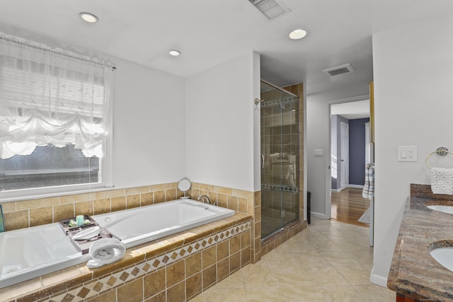 bathroom featuring a garden tub, a shower stall, visible vents, and tile patterned floors