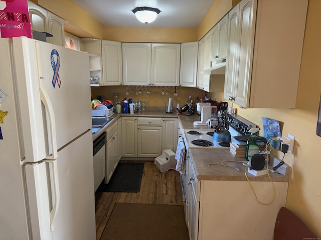 kitchen with white appliances, wood finished floors, under cabinet range hood, white cabinetry, and open shelves