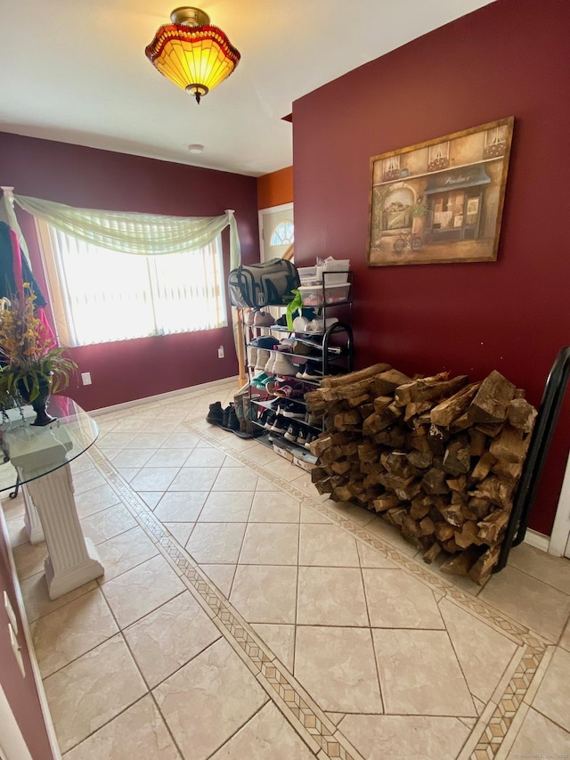 interior space with tile patterned flooring and baseboards