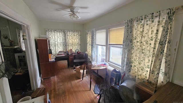 interior space with ceiling fan and wood finished floors