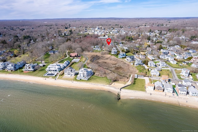 drone / aerial view featuring a residential view and a water view