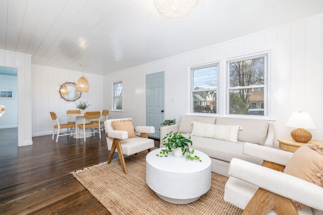 living room featuring wooden ceiling, dark wood-type flooring, and baseboards