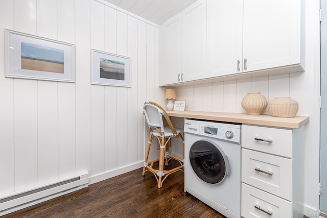 laundry area featuring a baseboard heating unit, washer / clothes dryer, dark wood-style floors, and cabinet space