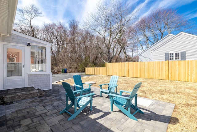 view of patio / terrace featuring fence