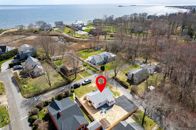 birds eye view of property with a water view and a residential view