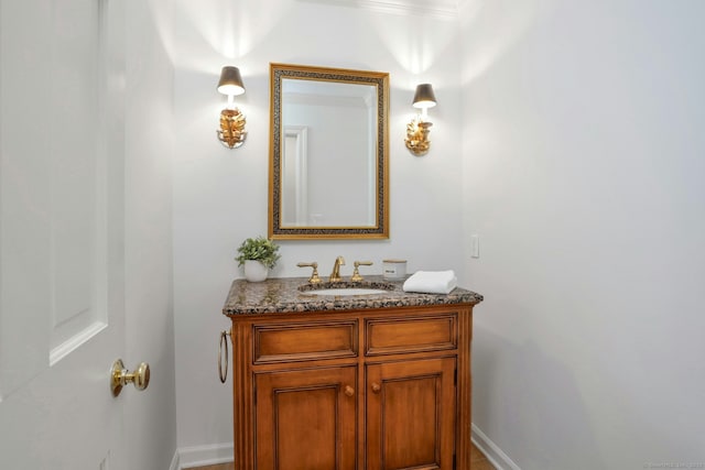 bathroom featuring vanity and baseboards