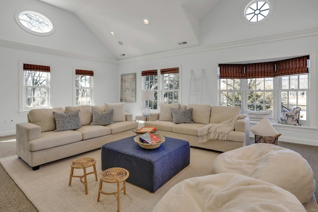 carpeted living area with high vaulted ceiling, visible vents, and baseboards