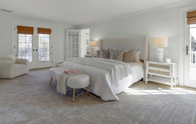 bedroom featuring visible vents, ornamental molding, access to exterior, carpet flooring, and french doors