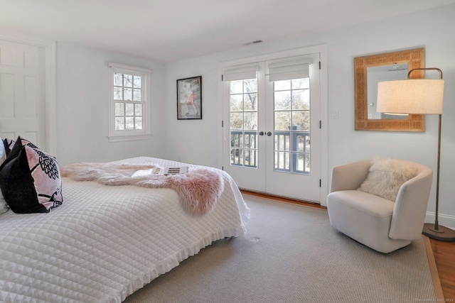 bedroom with access to outside, visible vents, and french doors