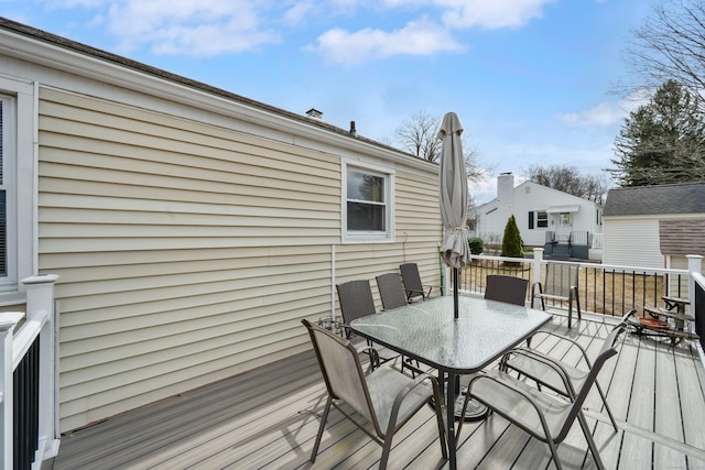 deck with outdoor dining area