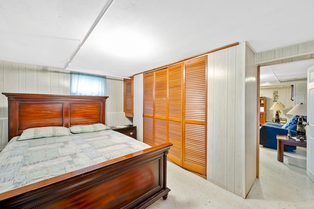 bedroom featuring a closet and concrete floors