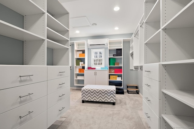 spacious closet with light carpet and a wall mounted AC