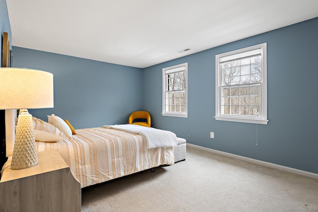 carpeted bedroom with baseboards