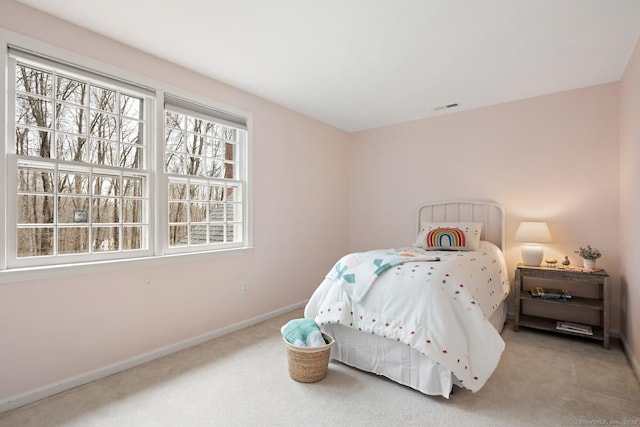 bedroom with carpet flooring, visible vents, and baseboards