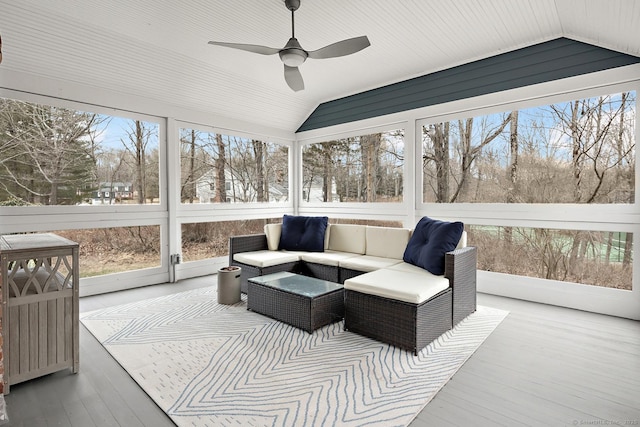 sunroom with a ceiling fan and vaulted ceiling