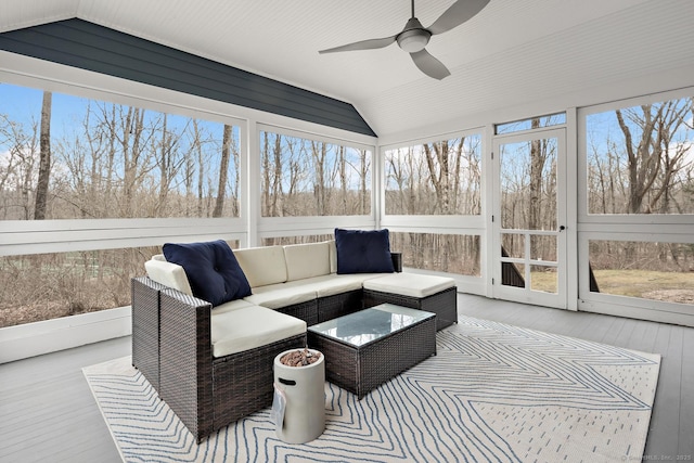 sunroom / solarium featuring vaulted ceiling and a ceiling fan