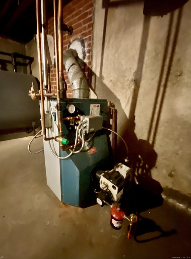 utility room with a heating unit and heating fuel