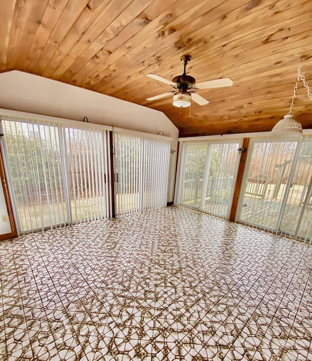 unfurnished sunroom with lofted ceiling, ceiling fan, and wood ceiling