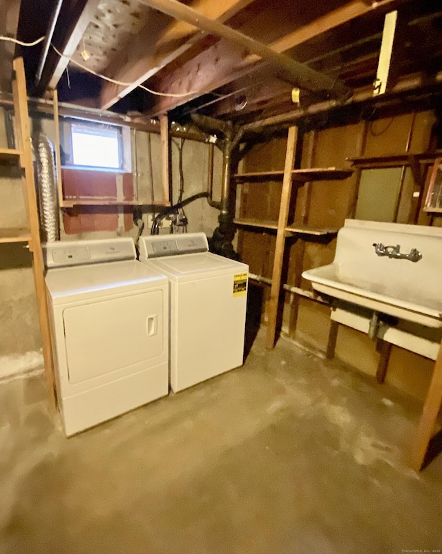 basement with washer and clothes dryer