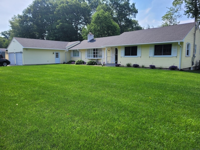 ranch-style home featuring a chimney and a front lawn