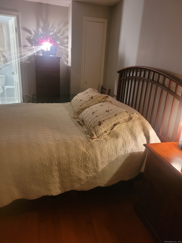 bedroom featuring wood finished floors