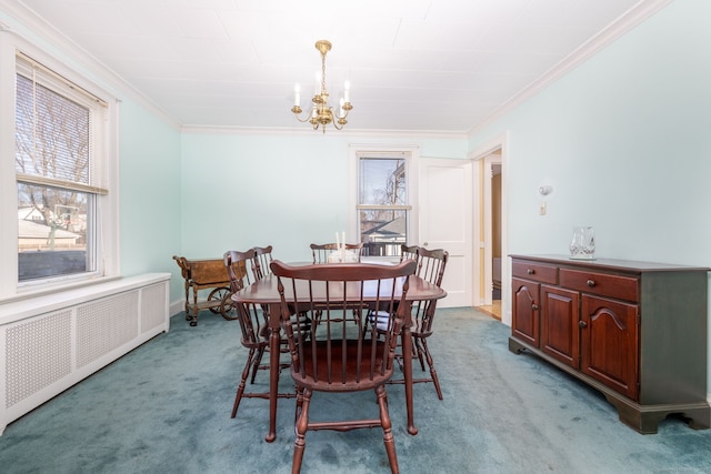 dining area featuring light colored carpet, radiator, crown molding, and an inviting chandelier