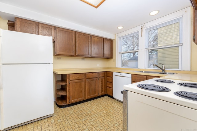 kitchen featuring open shelves, white appliances, brown cabinetry, and light countertops