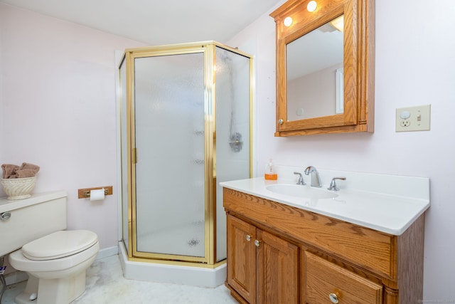 bathroom with vanity, toilet, and a shower stall