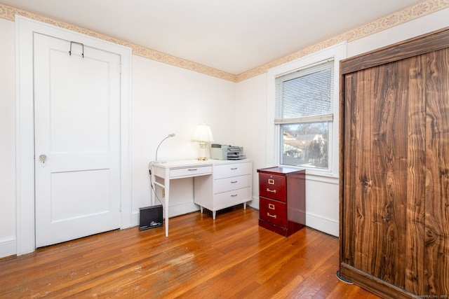 office with hardwood / wood-style flooring