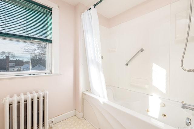 full bathroom with tile patterned floors, shower / tub combo, radiator heating unit, and baseboards