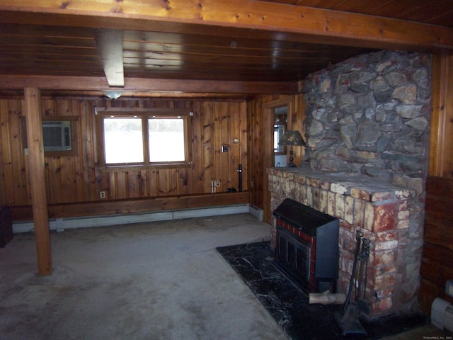 carpeted living area with an AC wall unit, a fireplace, beamed ceiling, and wood walls