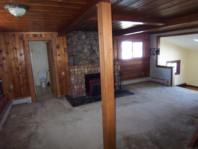 unfurnished living room with carpet floors, a baseboard radiator, lofted ceiling with beams, wood ceiling, and wooden walls