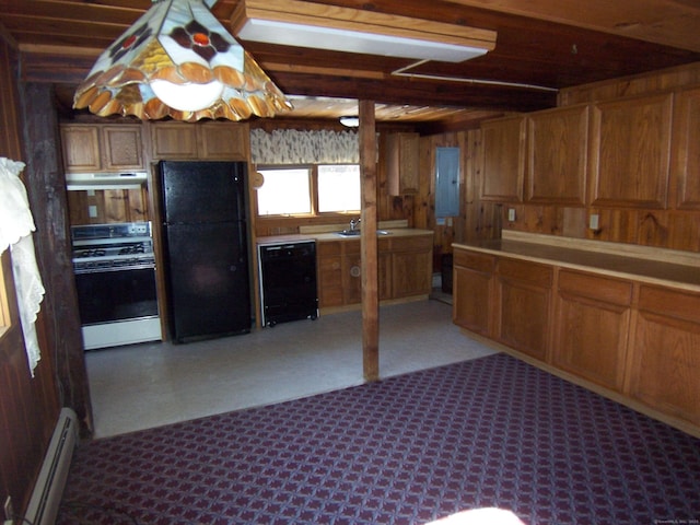 kitchen with under cabinet range hood, wood walls, baseboard heating, brown cabinets, and black appliances