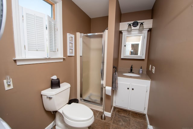 full bath featuring toilet, a shower stall, baseboards, and vanity