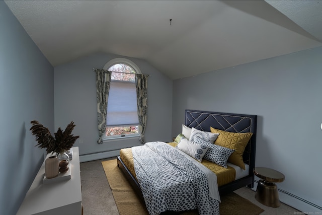 bedroom with lofted ceiling, a baseboard heating unit, and carpet flooring