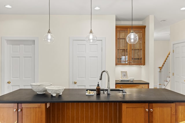 bar with recessed lighting, decorative light fixtures, a sink, and stairway