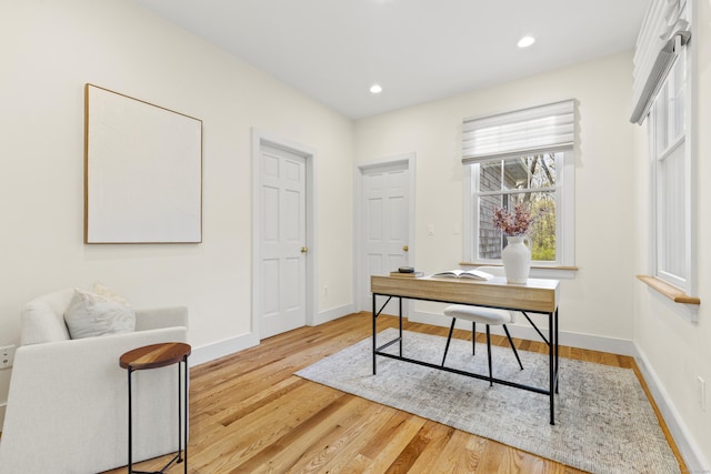 office area featuring recessed lighting, baseboards, and wood finished floors