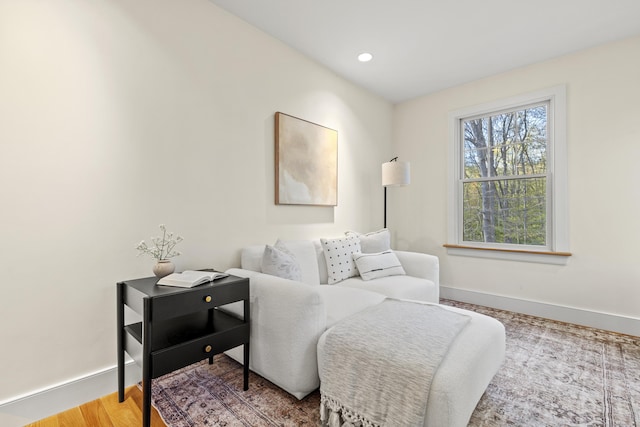 living area with baseboards and recessed lighting