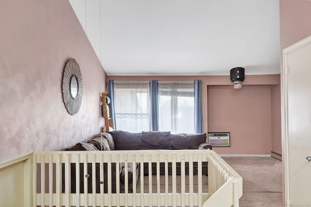 bedroom featuring a baseboard heating unit, carpet, a wall mounted air conditioner, and wallpapered walls