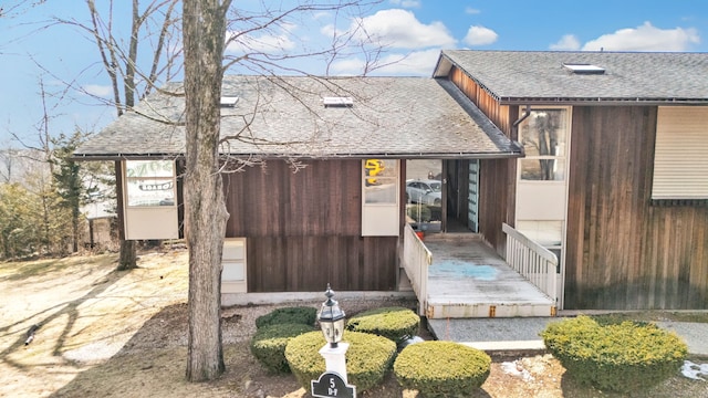 view of front of home with roof with shingles