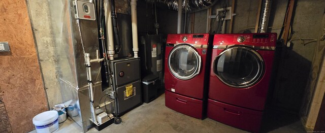 washroom with laundry area and washer and dryer