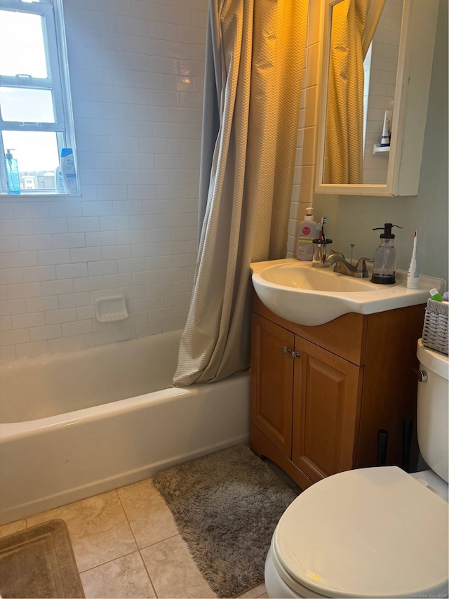 full bathroom featuring shower / tub combo, vanity, toilet, and tile patterned floors