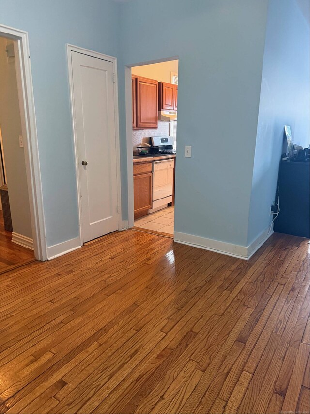 interior space with light wood-style flooring and baseboards