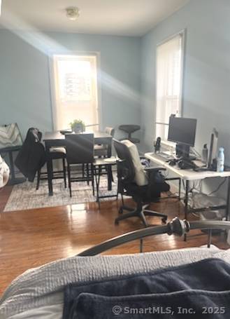 home office featuring wood finished floors