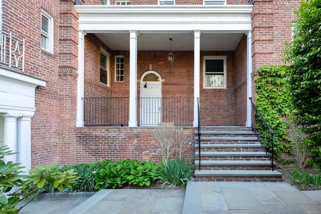 70 Strawberry Hill Ave Apt 3-3B, Stamford, CT 06902 - view of exterior entry with brick siding and a porch