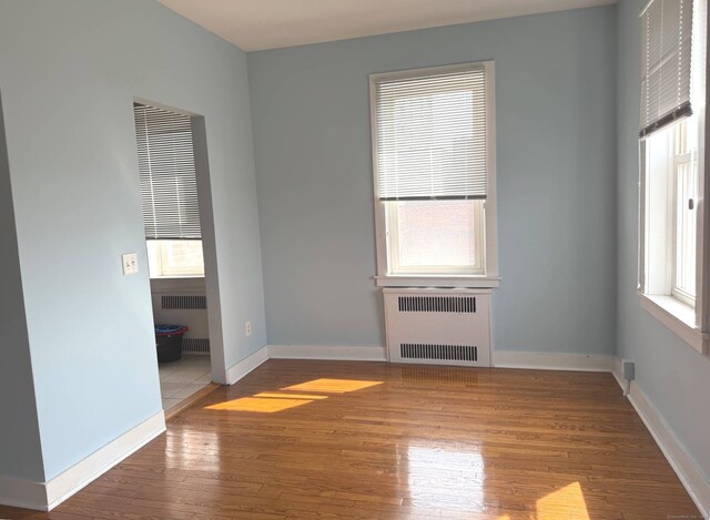 70 Strawberry Hill Ave Apt 3-3B, Stamford, CT 06902 - unfurnished room featuring radiator heating unit and wood finished floors